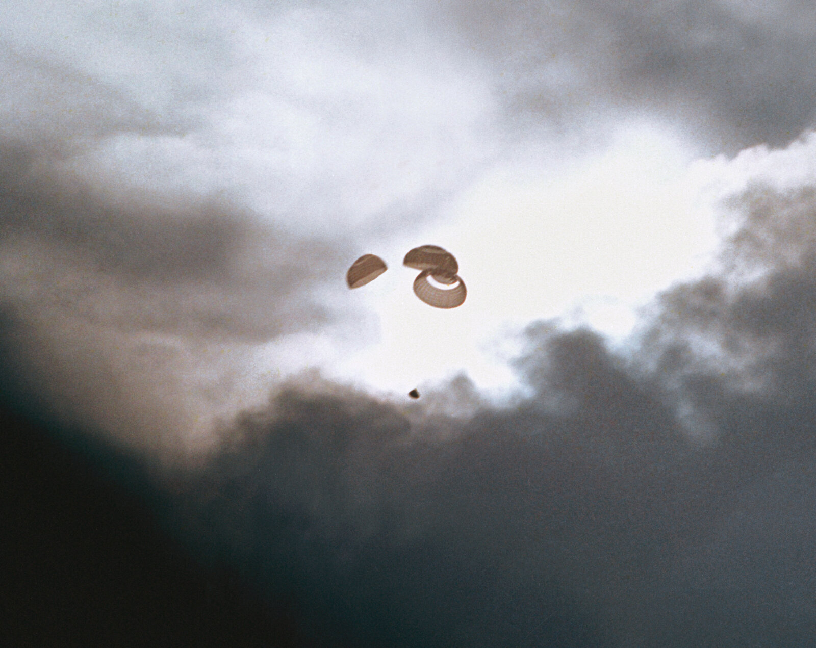Apollo 13 descending under three main parachutes