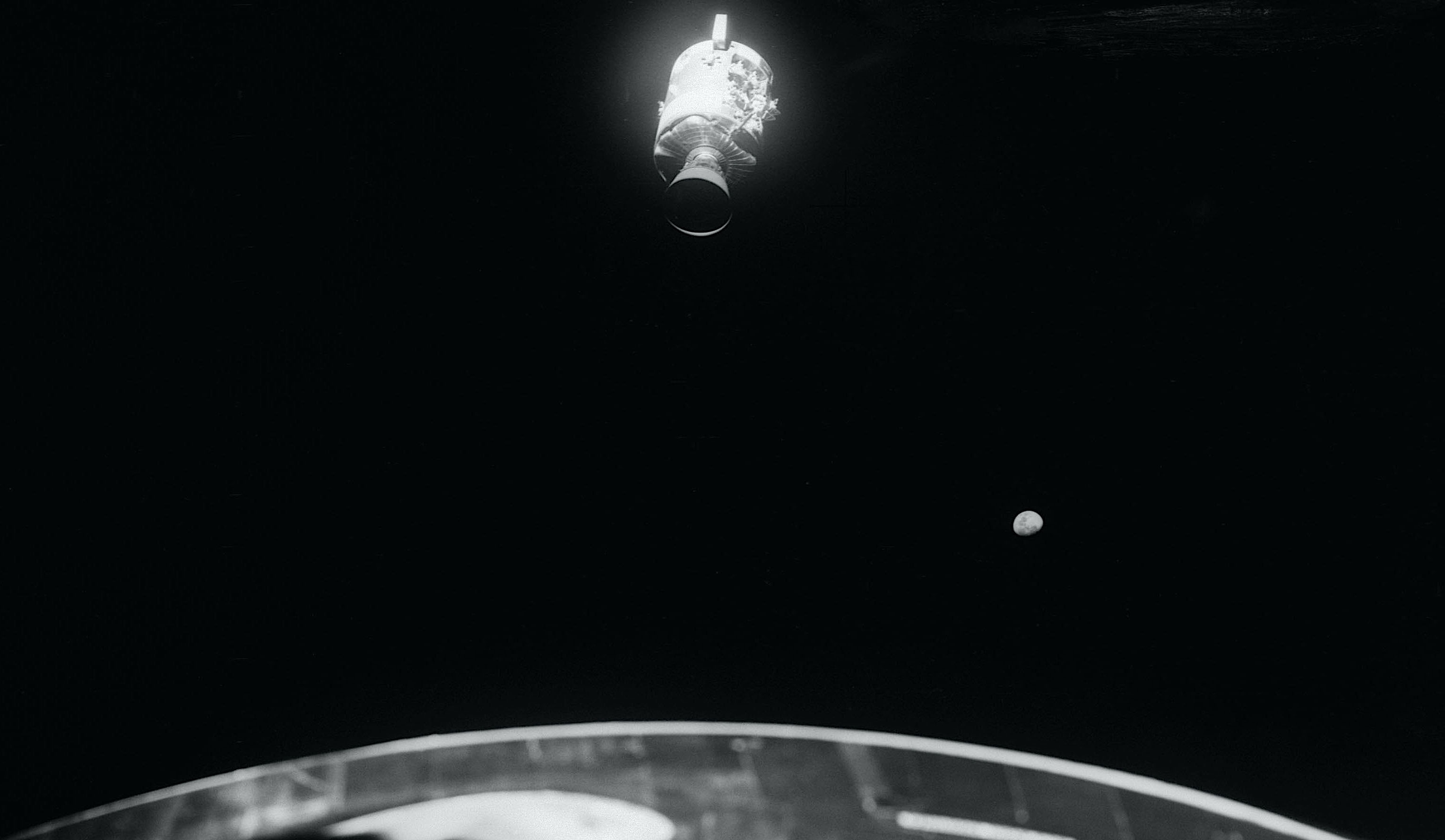 Damaged Service Module with the entire Bay 4 panel blown away, photographed by the crew after jettison